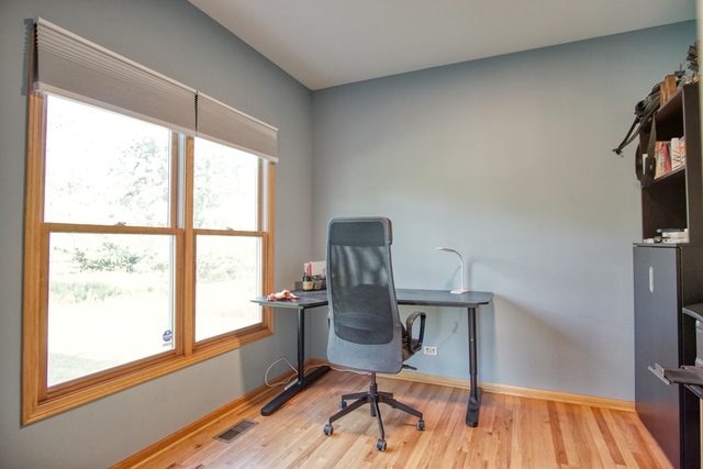 115 North Prospect Avenue Streamwood, IL 60107 - Photo 18 of 41 a view of a workspace with furniture and a window