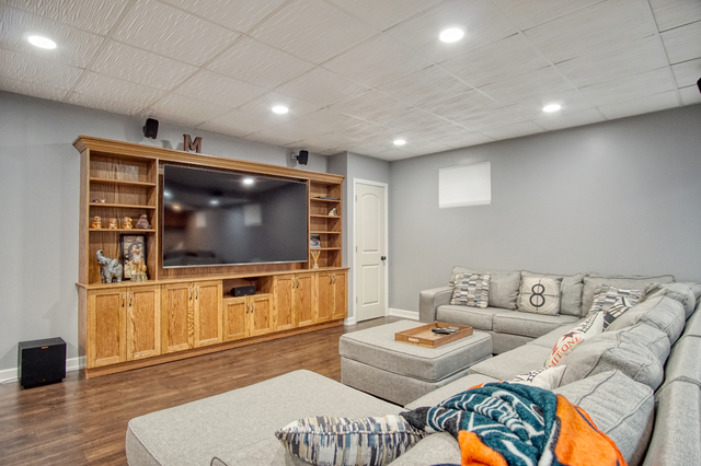 115 North Prospect Avenue Streamwood, IL 60107 - Photo 21 of 41 a living room with furniture and a flat screen tv