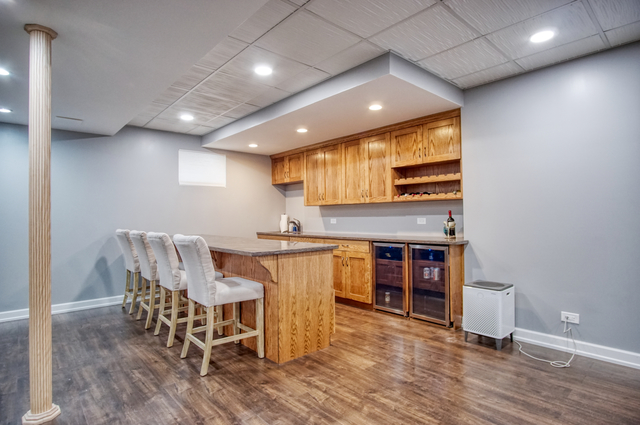 115 North Prospect Avenue Streamwood, IL 60107 - Photo 23 of 41 a open kitchen with a table and chairs