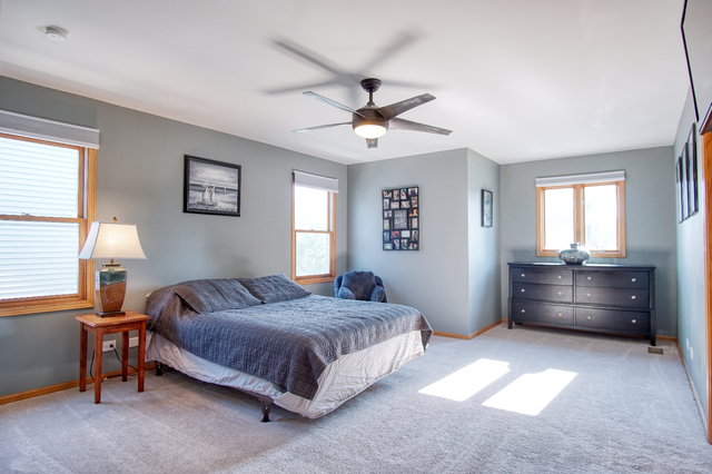 115 North Prospect Avenue Streamwood, IL 60107 - Photo 27 of 41 a spacious bedroom with a bed and a window
