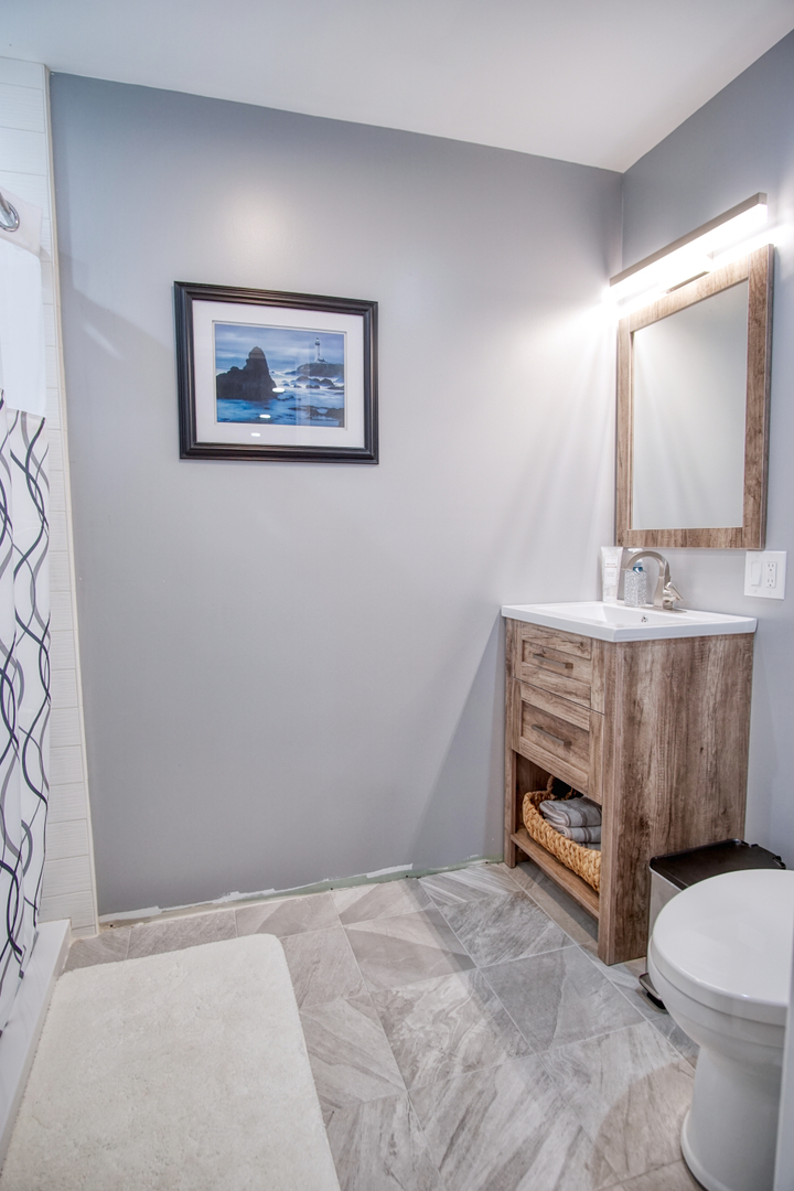 115 North Prospect Avenue Streamwood, IL 60107 - Photo 32 of 41 a bathroom with a sink toilet and mirror