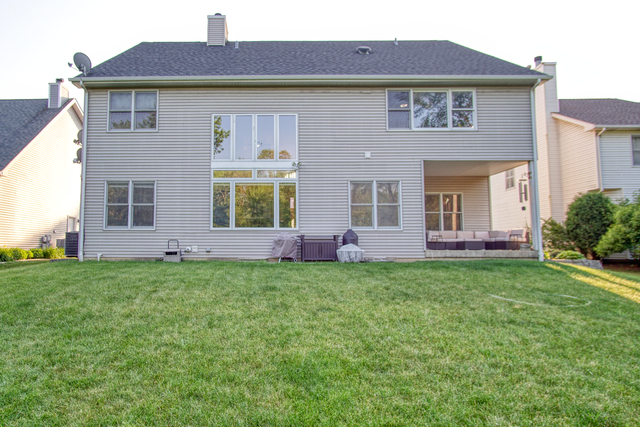 115 North Prospect Avenue Streamwood, IL 60107 - Photo 38 of 41 a front view of a house with a garden