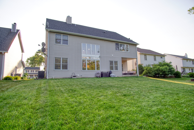115 North Prospect Avenue Streamwood, IL 60107 - Photo 39 of 41 a view of a house with backyard and garden