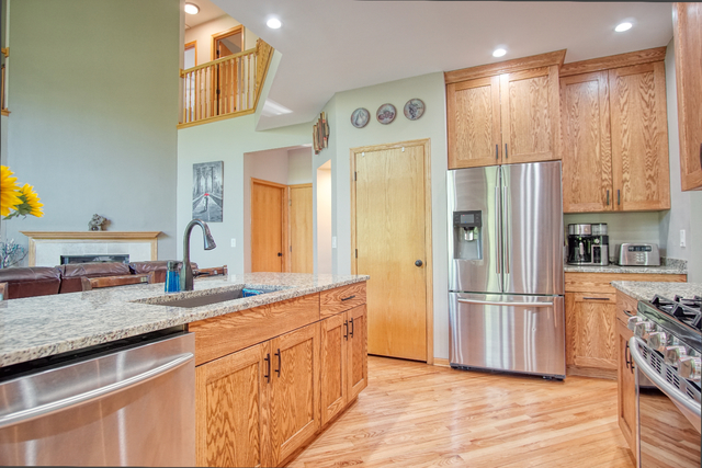 115 North Prospect Avenue Streamwood, IL 60107 - Photo 7 of 41 a kitchen with stainless steel appliances granite countertop a refrigerator and a sink