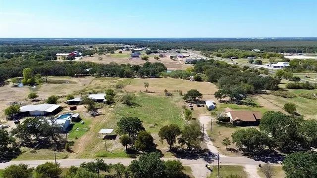 a view of a street with a yard