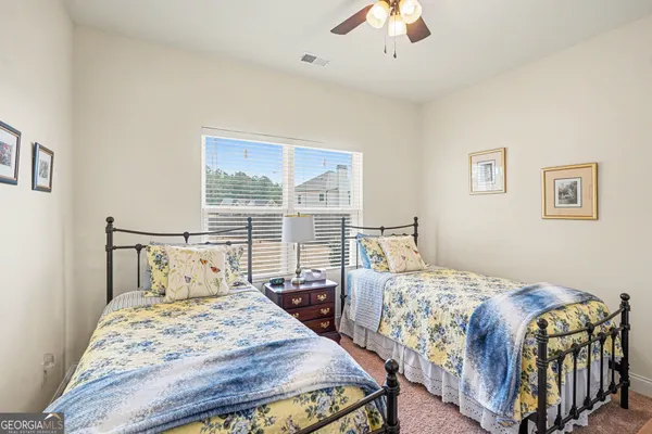 a livingroom with a workspace and a couch