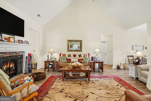 a kitchen with stainless steel appliances granite countertop a sink dishwasher stove refrigerator and cabinets