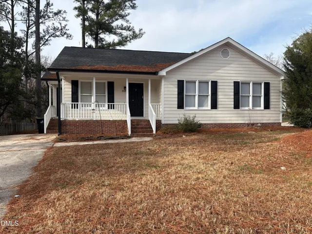 front view of a house with a yard