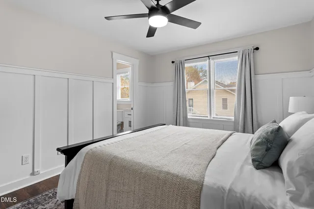 a bedroom with a large bed and a window