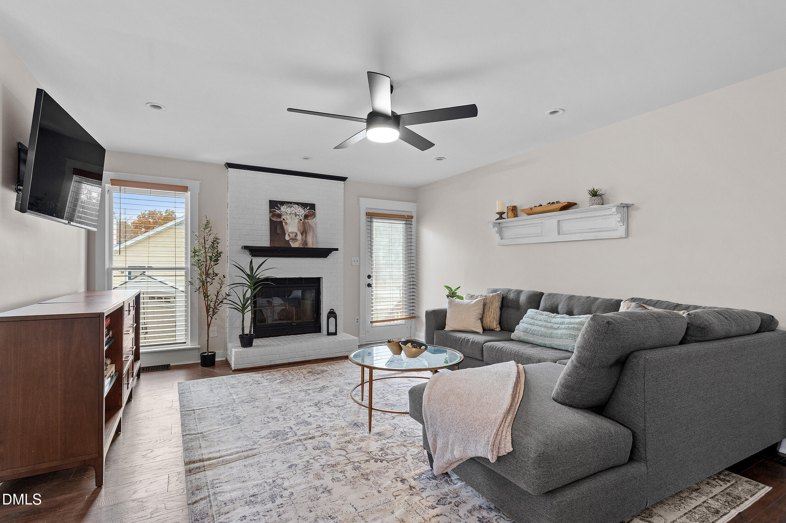 3525 Castlegate Drive Raleigh, NC 27616 - Photo 2 of 15 a living room with furniture and a fireplace