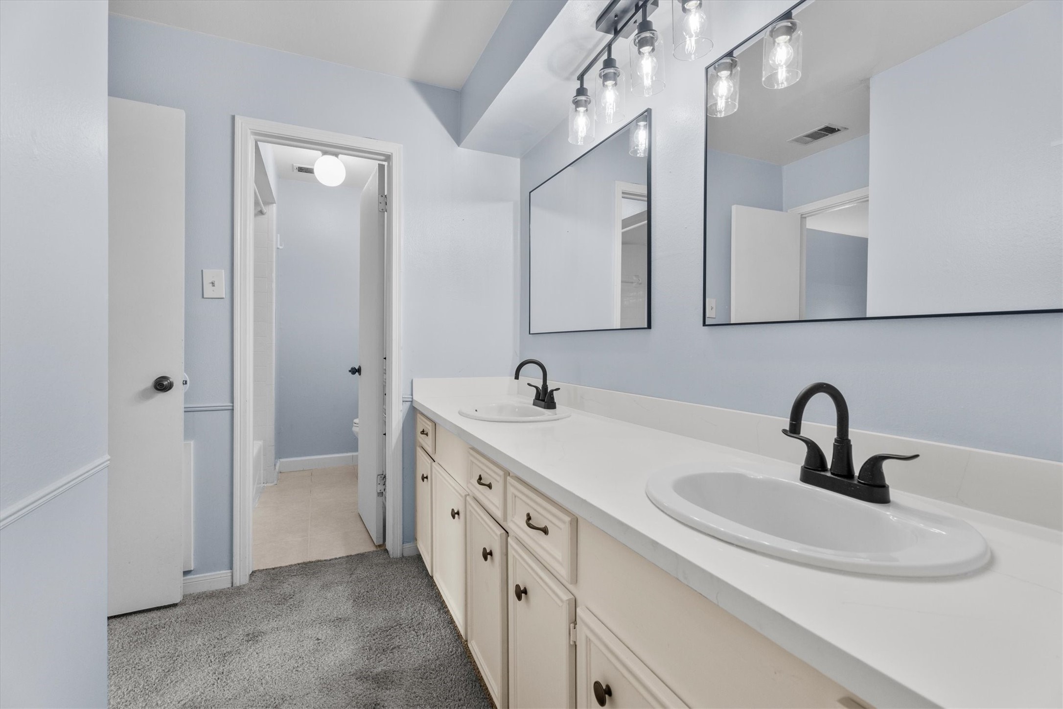 17319 Cypress Spring Drive Spring, TX 77388 - Photo 33 of 50 The double bowl vanity enjoys new quartz countertops, sinks, faucents, mirrors, and light fixtures as well. The separate water closet and shower/tub combination allow for more than to get ready for the day.