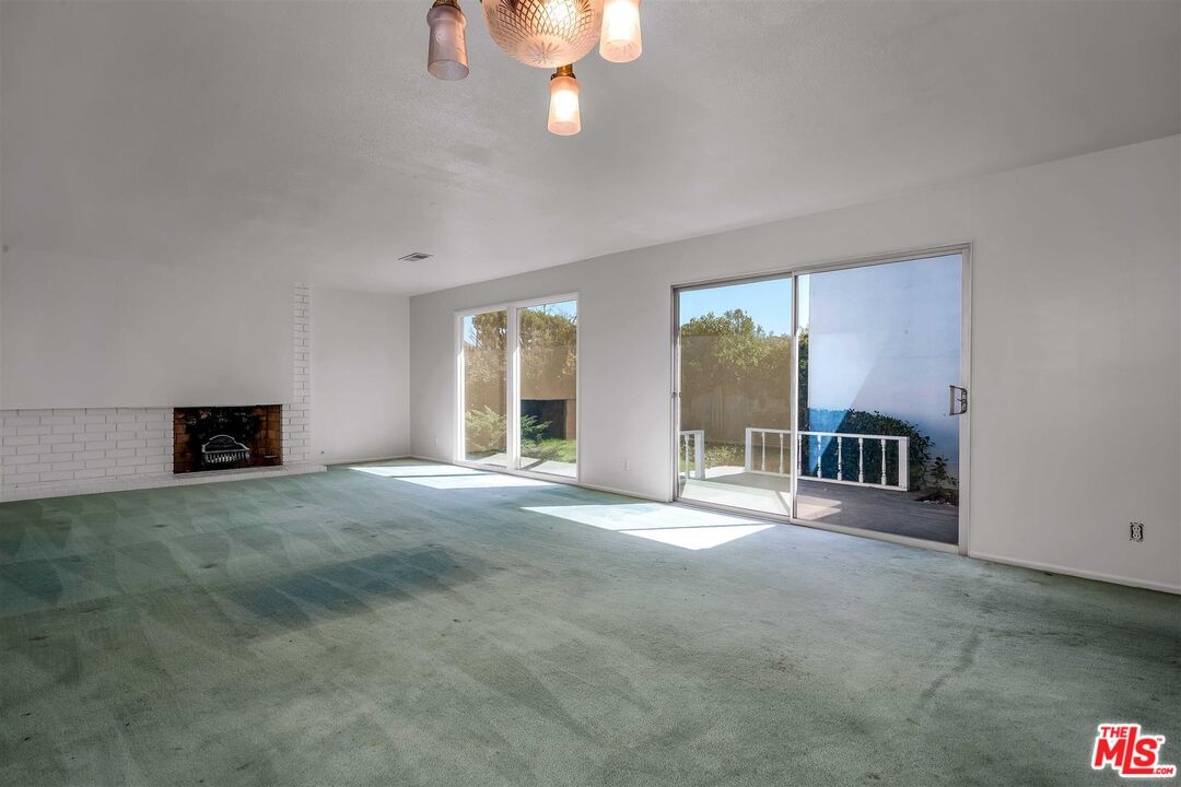 29636 Stonecrest Road Rancho Palos Verdes, CA 90275 - Photo 13 of 32 a view of an empty room with a fireplace and a window