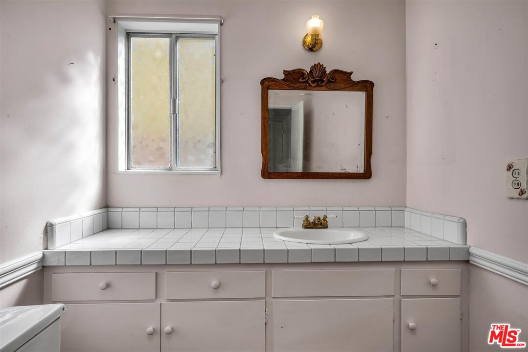 29636 Stonecrest Road Rancho Palos Verdes, CA 90275 - Photo 23 of 32 a bathroom with a sink and a mirror