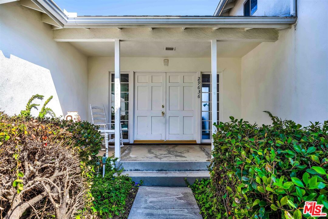 29636 Stonecrest Road Rancho Palos Verdes, CA 90275 - Photo 3 of 32 a view of a pathway of a house with potted plants