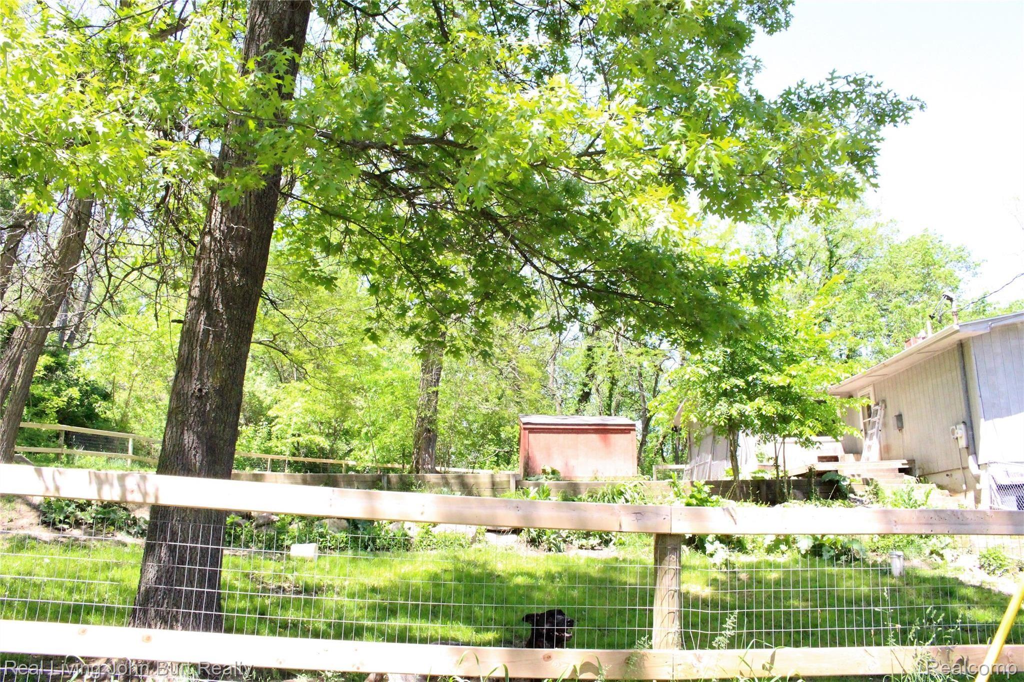 4965 Perryville Road Holly, MI 48442 - Photo 23 of 29 Retaining wall, new fence, gate for a safe confined area