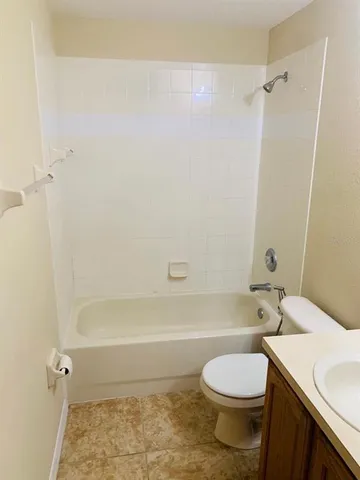 a bathroom with a sink a toilet and a bathtub