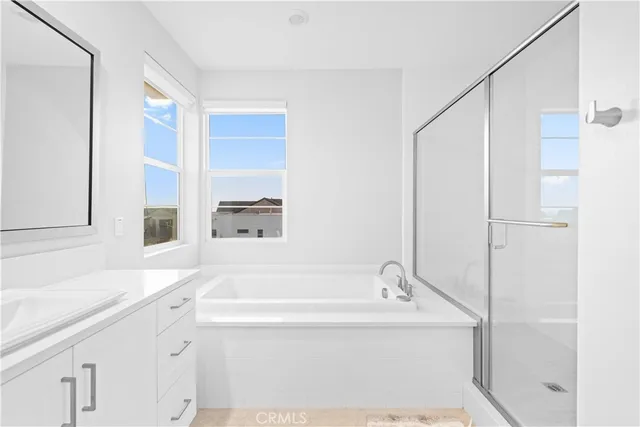 a bathroom with a bathtub and a sink