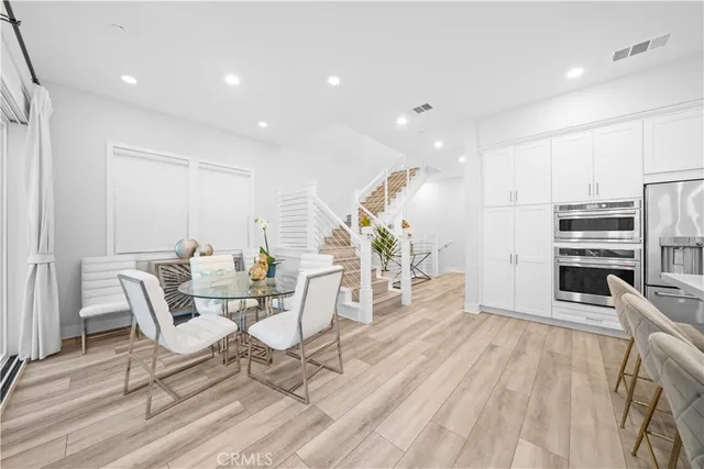 a living room with fireplace furniture and a wooden floor