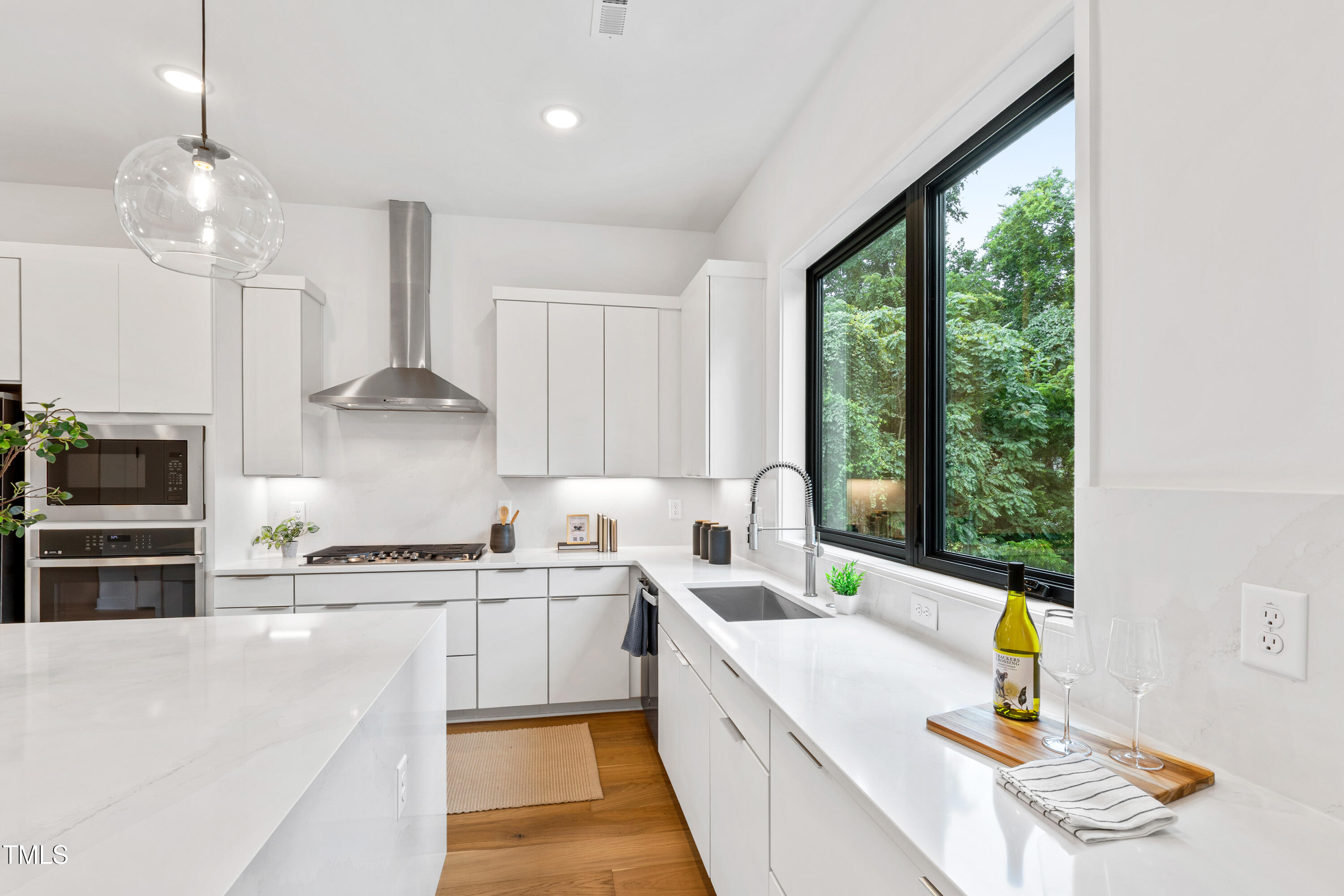 511 Edgecreek Court Raleigh, NC 27604 - Photo 17 of 58 a kitchen with a sink appliances cabinets and a counter top space