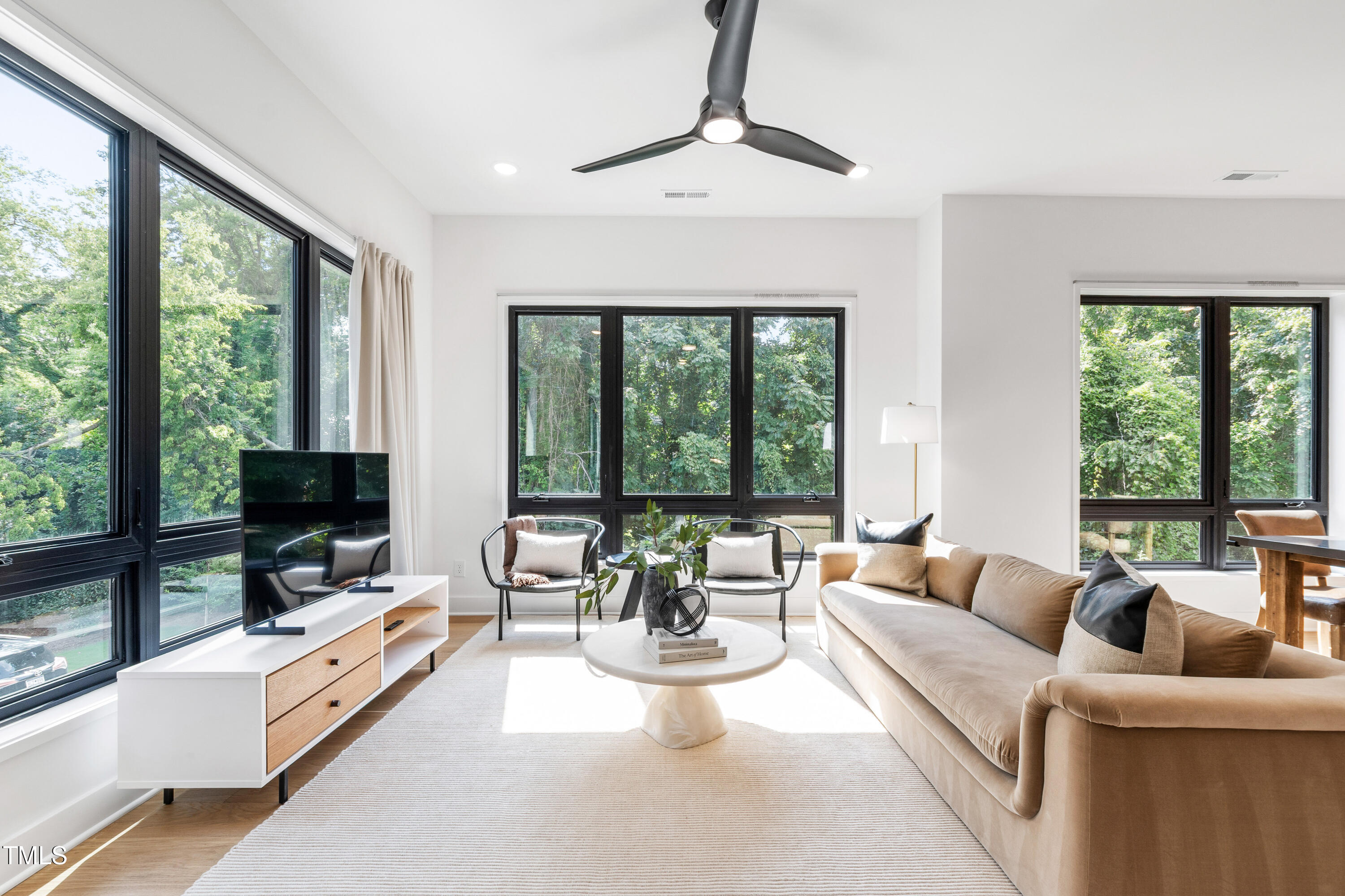 511 Edgecreek Court Raleigh, NC 27604 - Photo 27 of 58 a living room with furniture and large windows