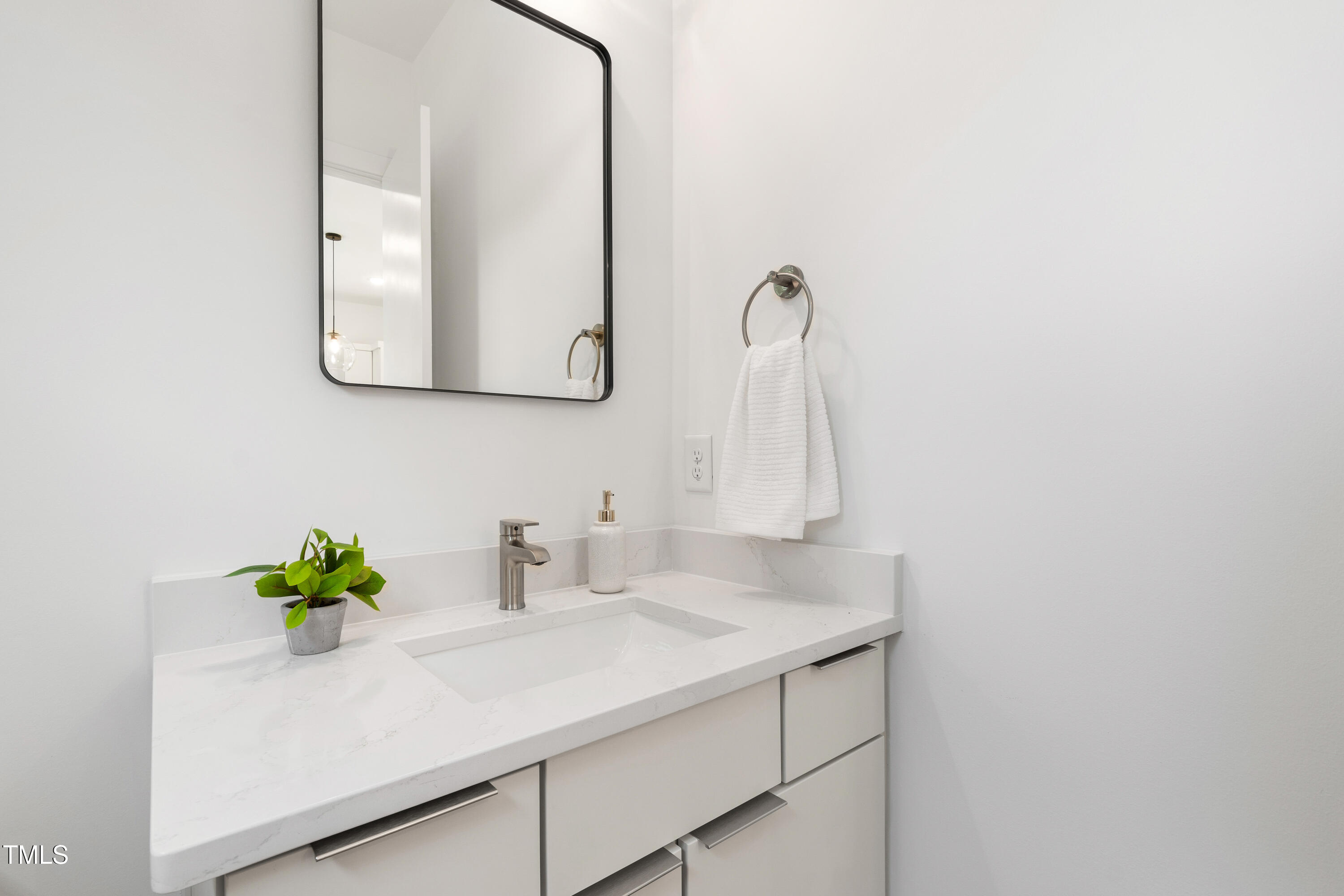 511 Edgecreek Court Raleigh, NC 27604 - Photo 29 of 58 a bathroom with a sink a vanity and a mirror