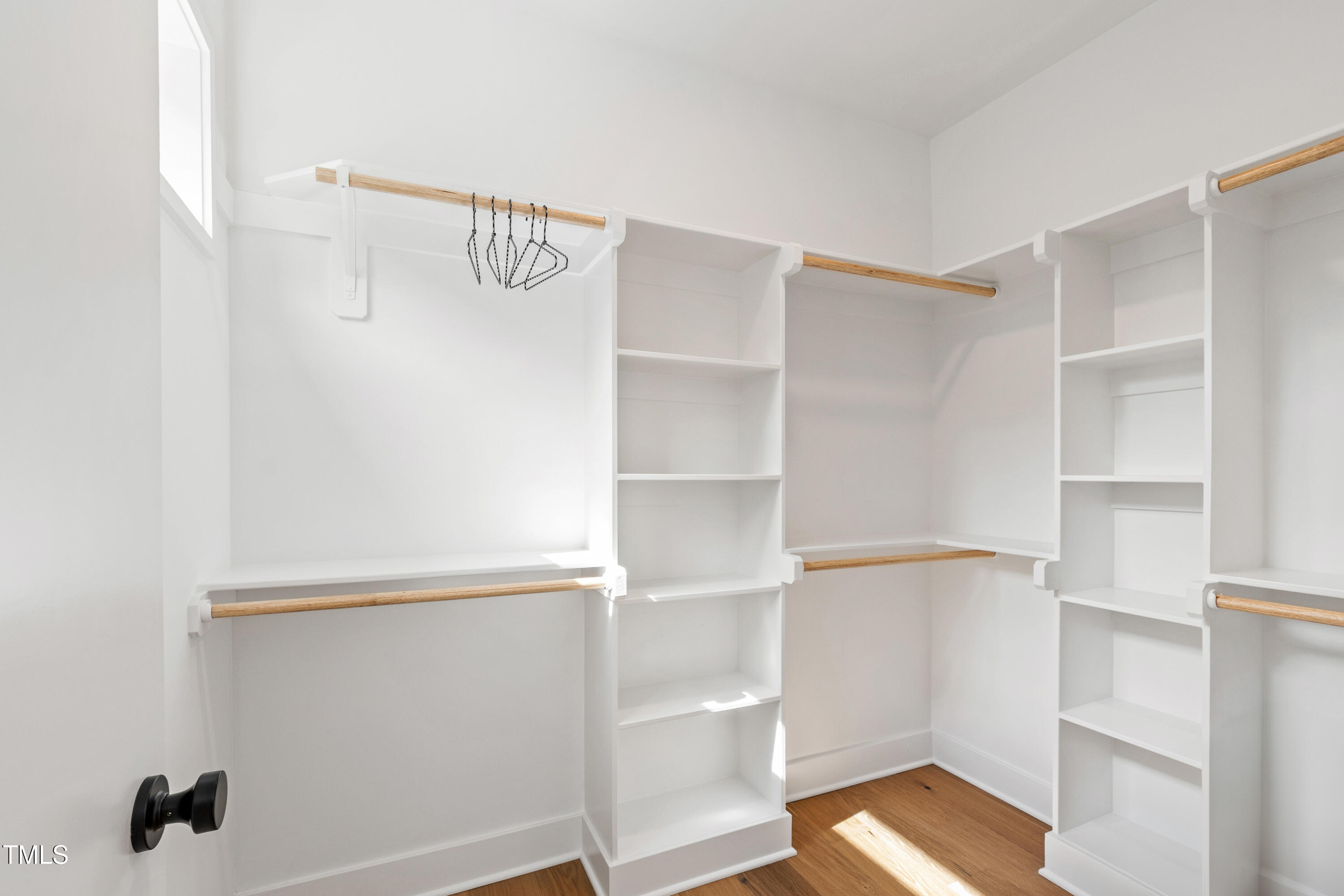 511 Edgecreek Court Raleigh, NC 27604 - Photo 33 of 58 a view of walk in closet with empty racks