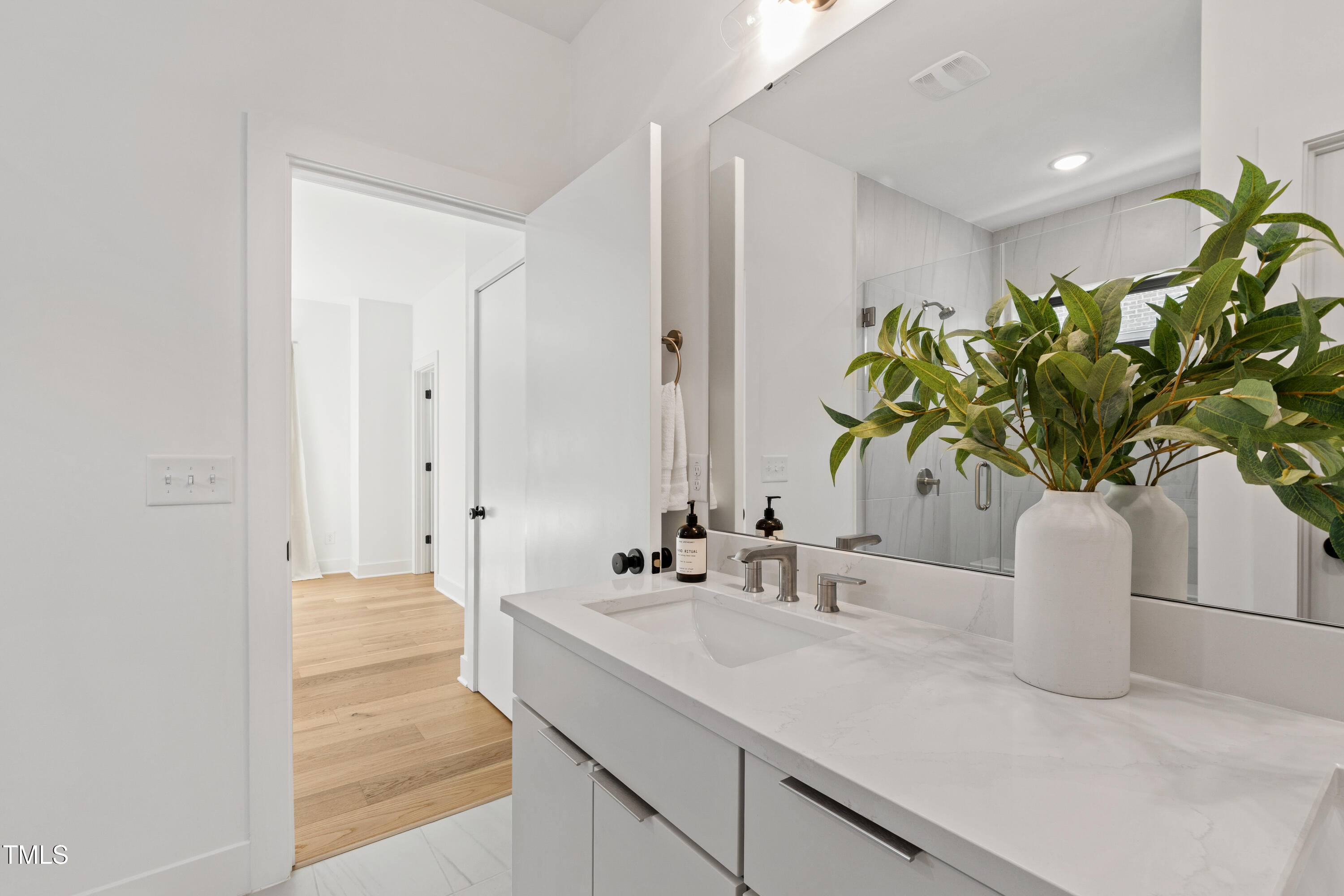 511 Edgecreek Court Raleigh, NC 27604 - Photo 36 of 58 a bathroom with a sink a vanity and a mirror