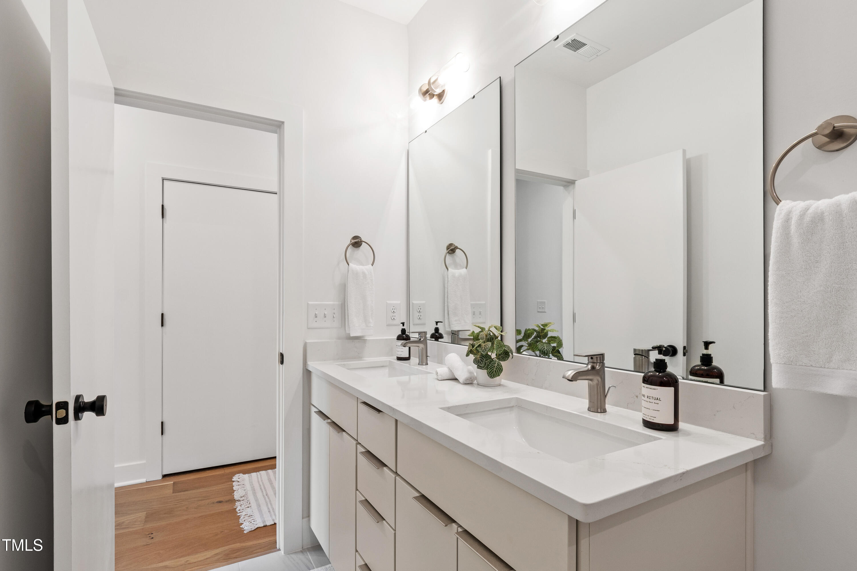 511 Edgecreek Court Raleigh, NC 27604 - Photo 38 of 58 a bathroom with a sink and a mirror