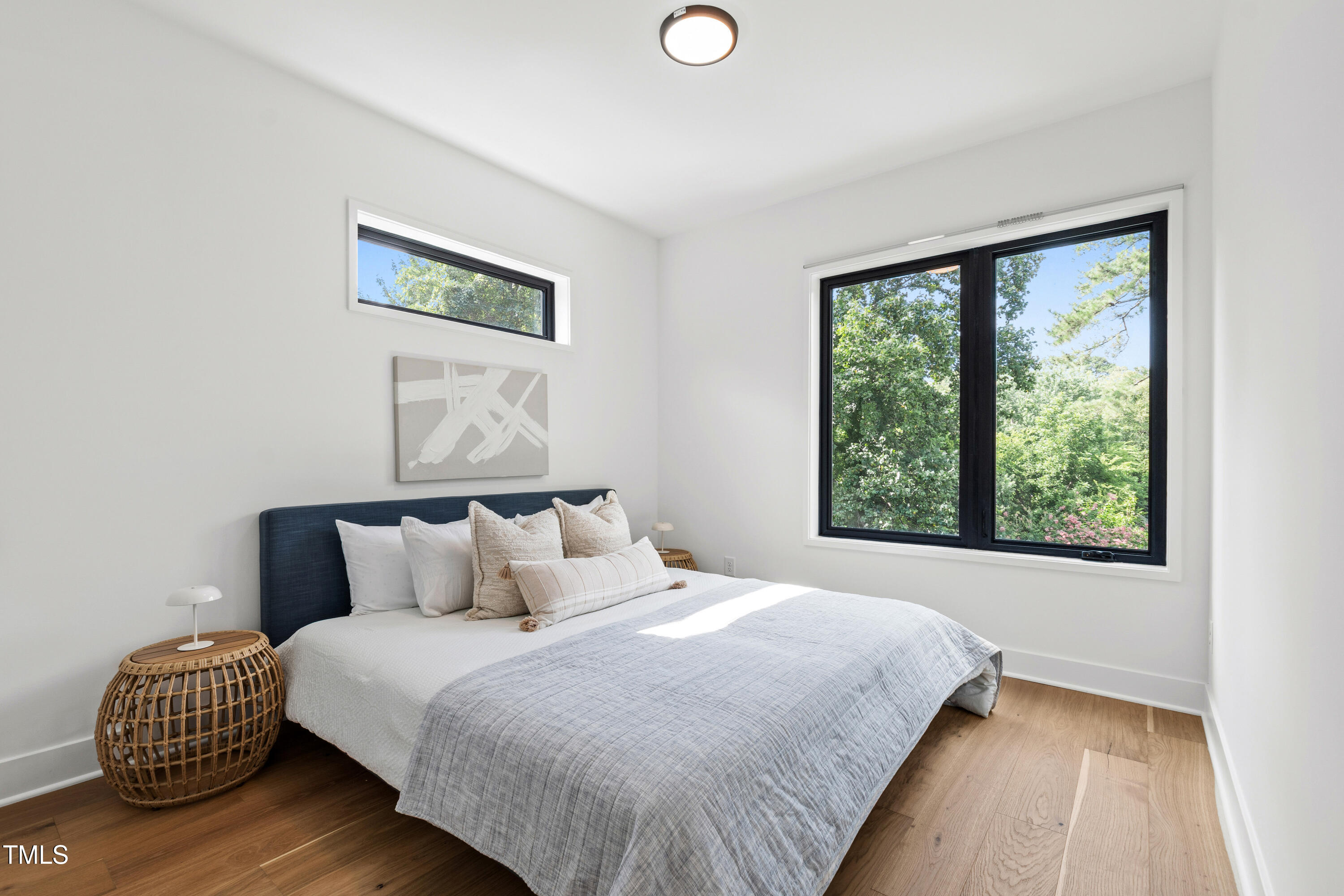 511 Edgecreek Court Raleigh, NC 27604 - Photo 42 of 58 a bedroom with a bed and a large window
