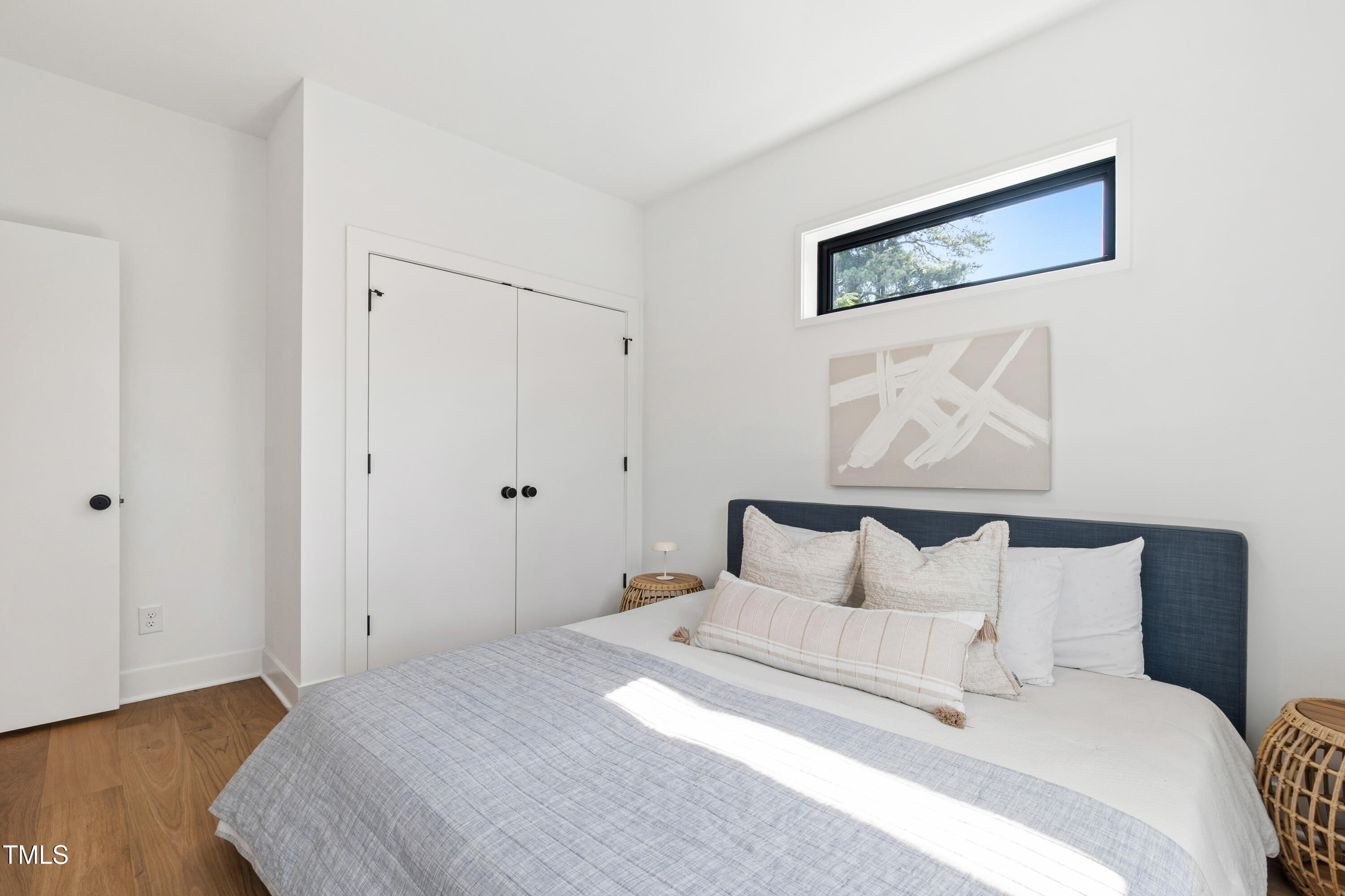 511 Edgecreek Court Raleigh, NC 27604 - Photo 43 of 58 a bedroom with a bed and a painting on the wall