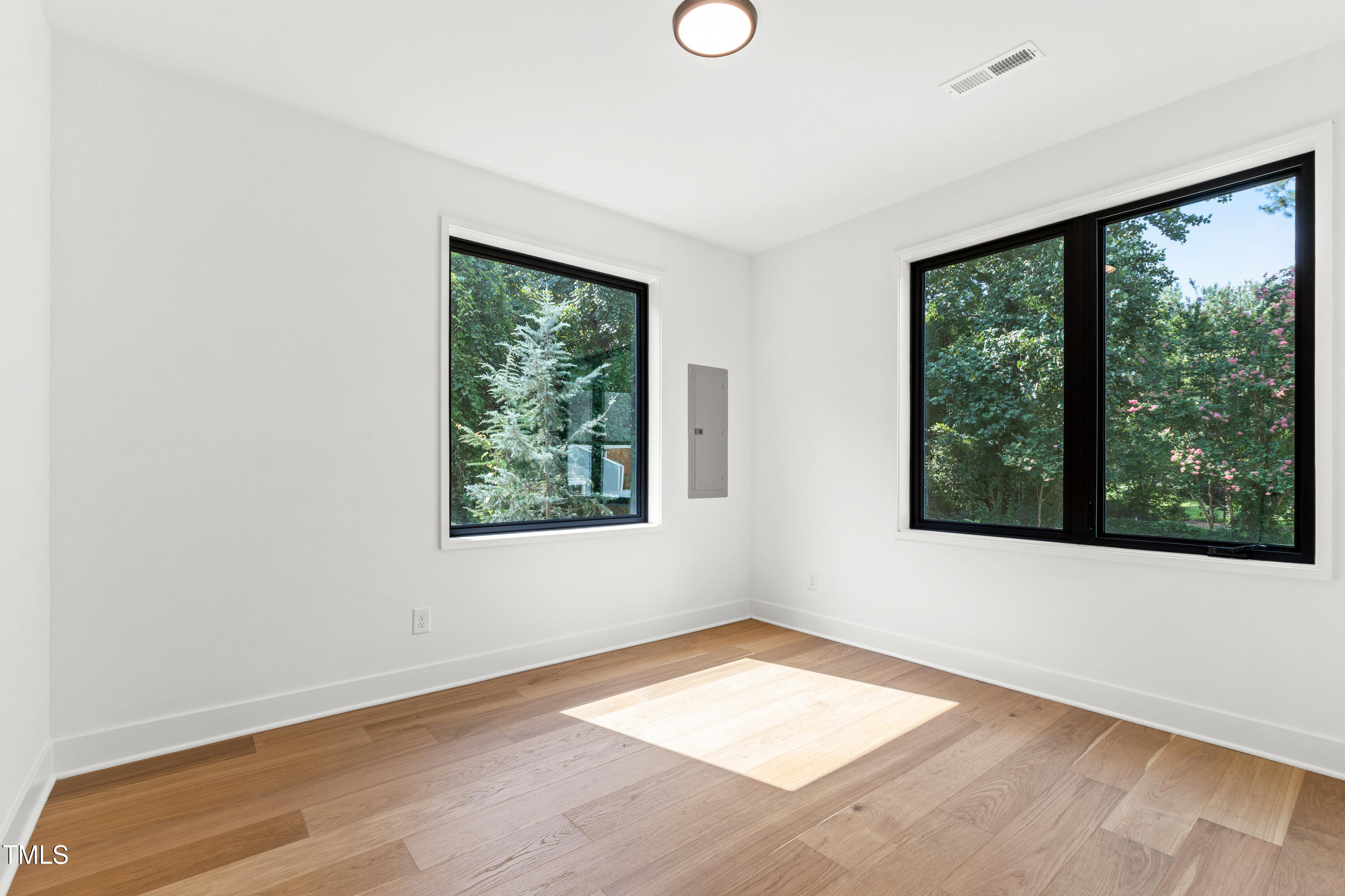 511 Edgecreek Court Raleigh, NC 27604 - Photo 5 of 58 an empty room with wooden floor and windows