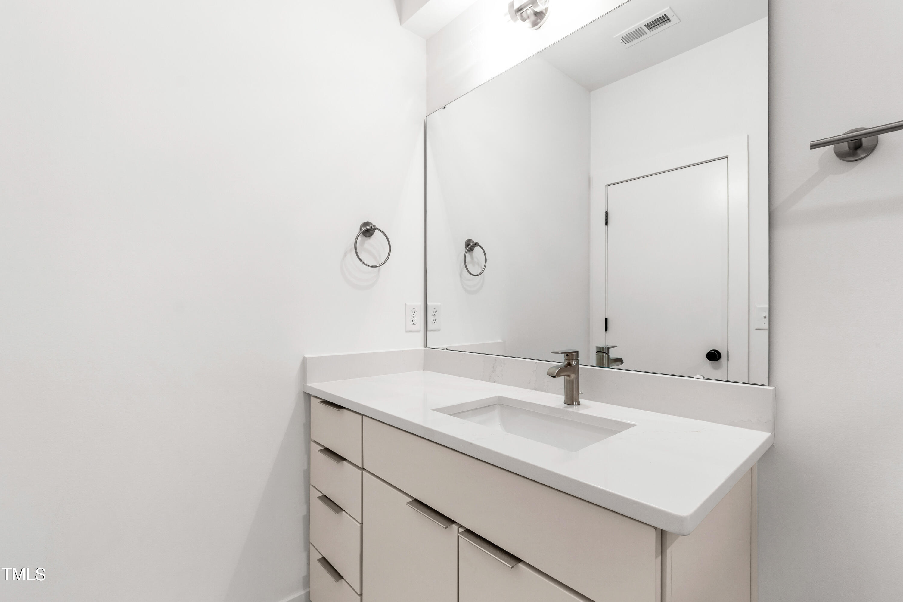 511 Edgecreek Court Raleigh, NC 27604 - Photo 7 of 58 a bathroom with a sink a mirror and vanity