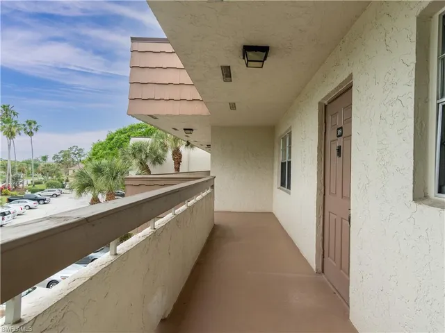 a view of a balcony with a sink and dishwasher
