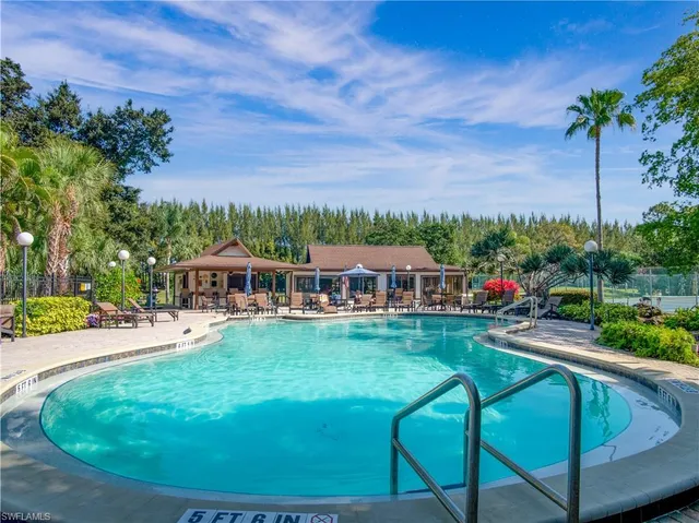 a view of a house with backyard porch and sitting area