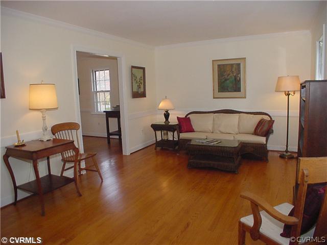 3017 Williamswood Road Richmond, VA 23235 - Photo 2 of 12 a bedroom with furniture and a lamp