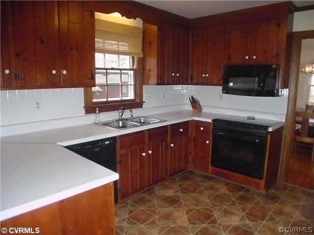 3017 Williamswood Road Richmond, VA 23235 - Photo 5 of 12 a kitchen with stainless steel appliances granite countertop a stove a sink and a microwave