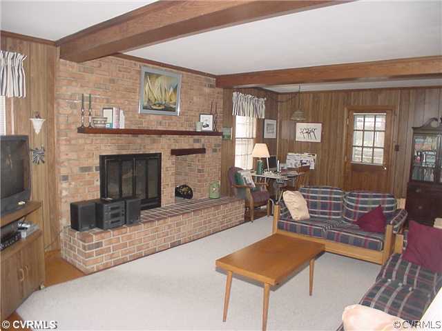 3017 Williamswood Road Richmond, VA 23235 - Photo 6 of 12 a living room with furniture and a fireplace