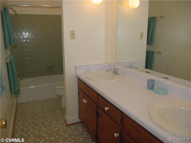 3017 Williamswood Road Richmond, VA 23235 - Photo 9 of 12 a bathroom with a sink a toilet and shower