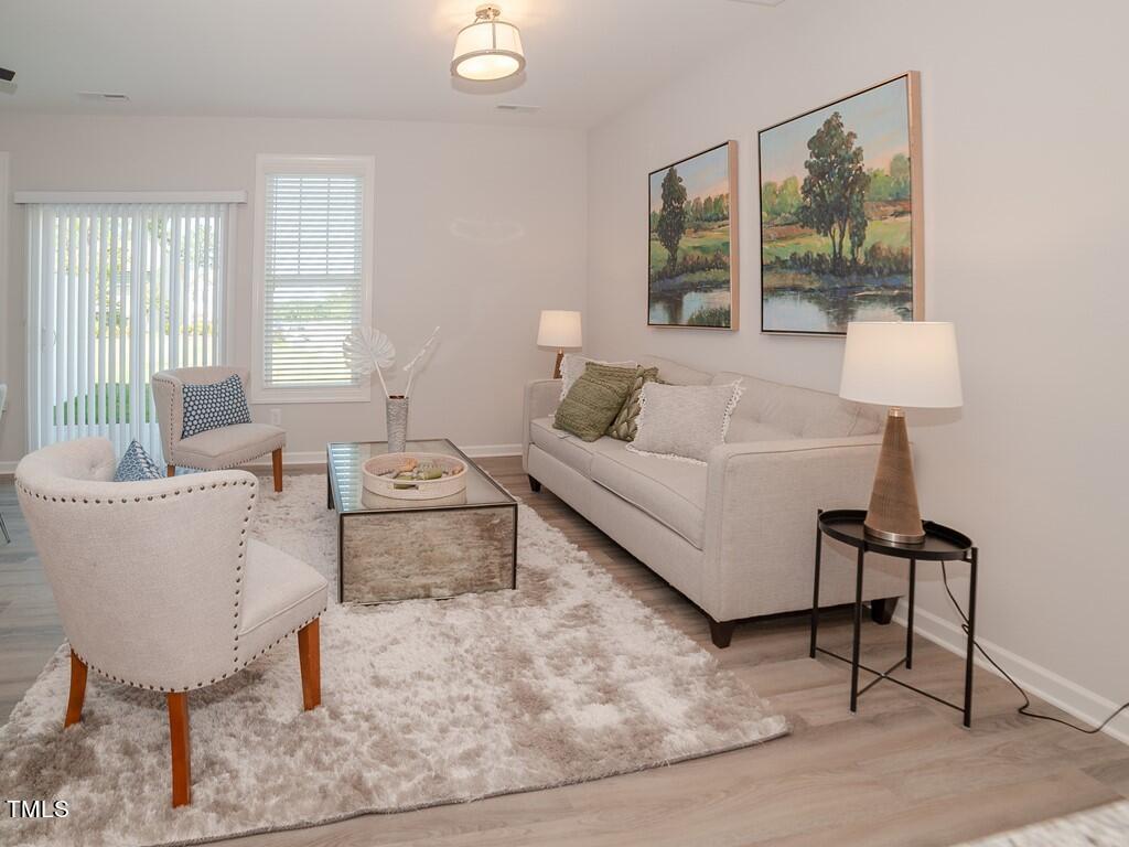 137 Rolesville Ridge Drive Rolesville, NC 27571 - Photo 8 of 17 a living room with furniture and a large window