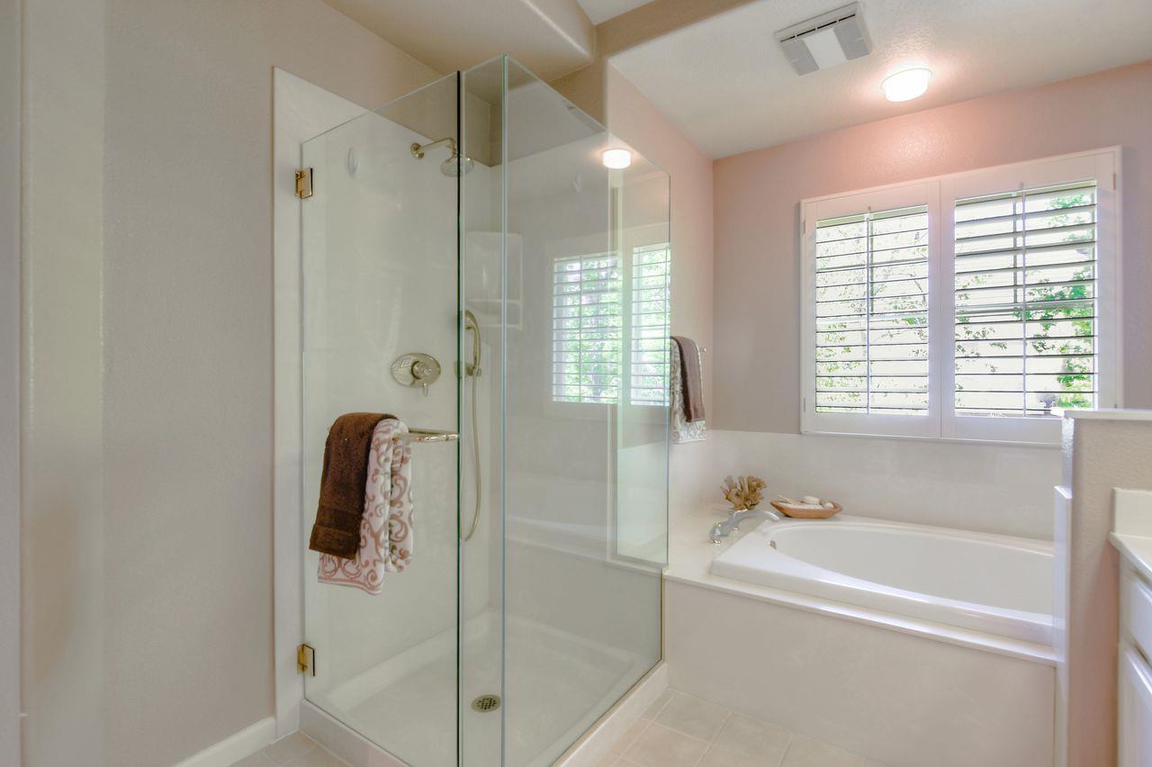 463 Mill River Lane San Jose, CA 95134 - Photo 24 of 30 a bathroom with a bathtub a shower and a sink