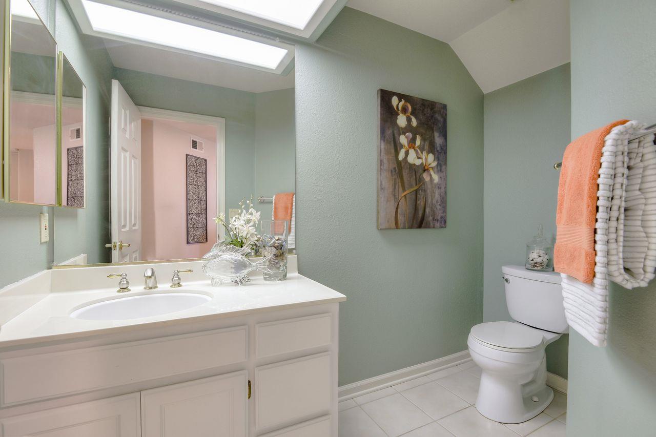 463 Mill River Lane San Jose, CA 95134 - Photo 26 of 30 a bathroom with a toilet sink and mirror