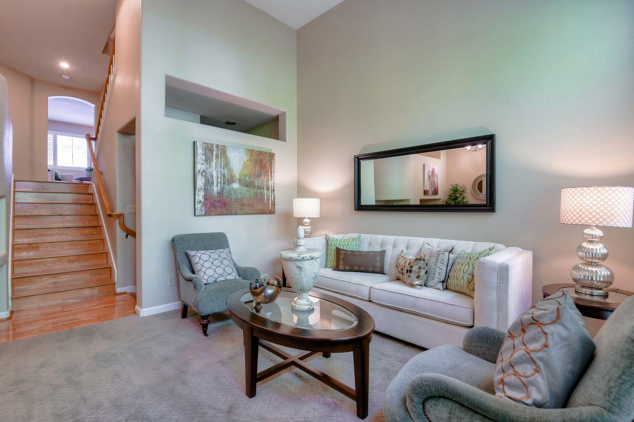463 Mill River Lane San Jose, CA 95134 - Photo 6 of 30 a living room with furniture and a painting on the wall
