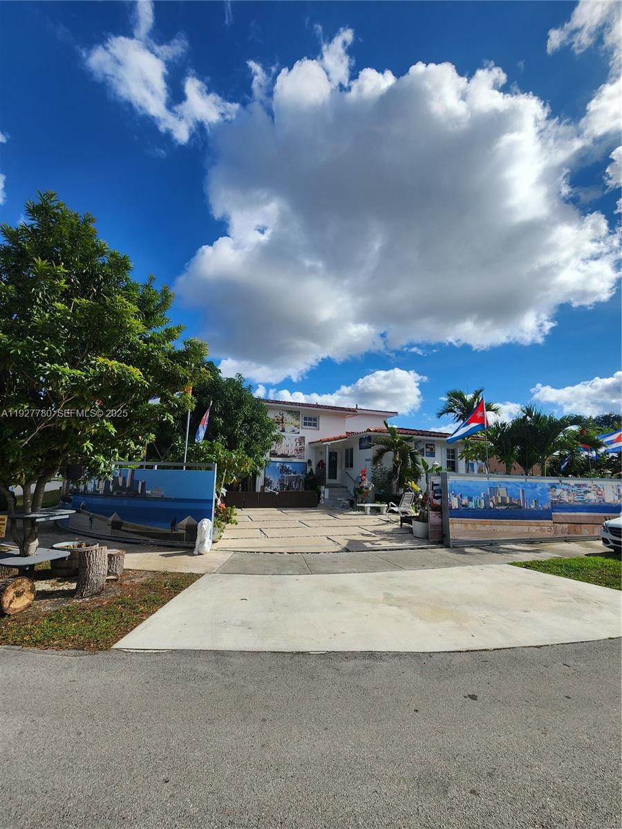 a view of a fountain in front of a house
