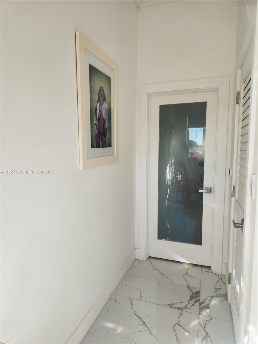 1645 Southwest 83rd Ct. Miami, FL 33155 - Photo 24 of 45 an empty room that has a mirror in it