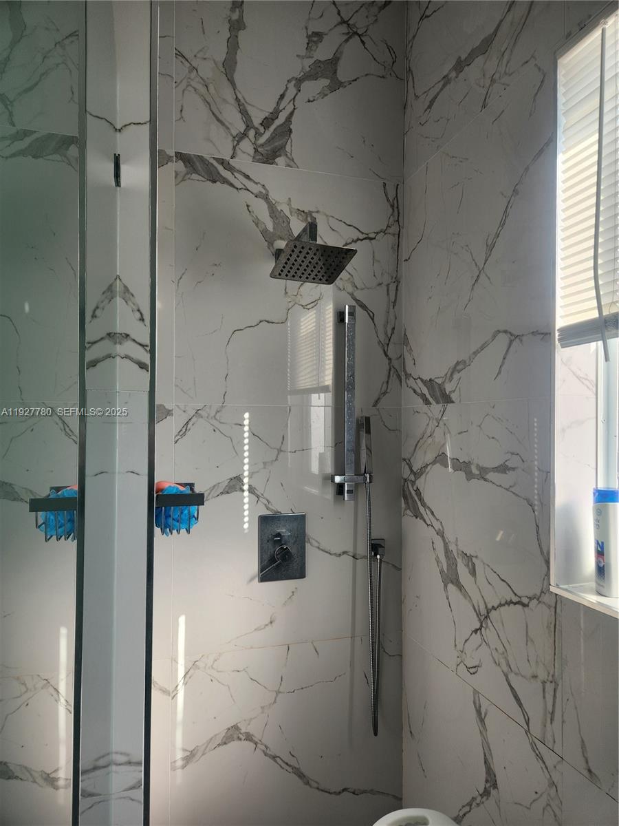 1645 Southwest 83rd Ct. Miami, FL 33155 - Photo 26 of 45 a bathroom with a shower