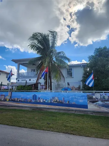 a view of swimming pool with a yard