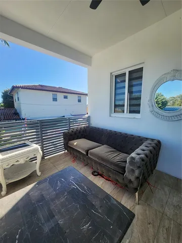 a view of a chairs and table in a patio