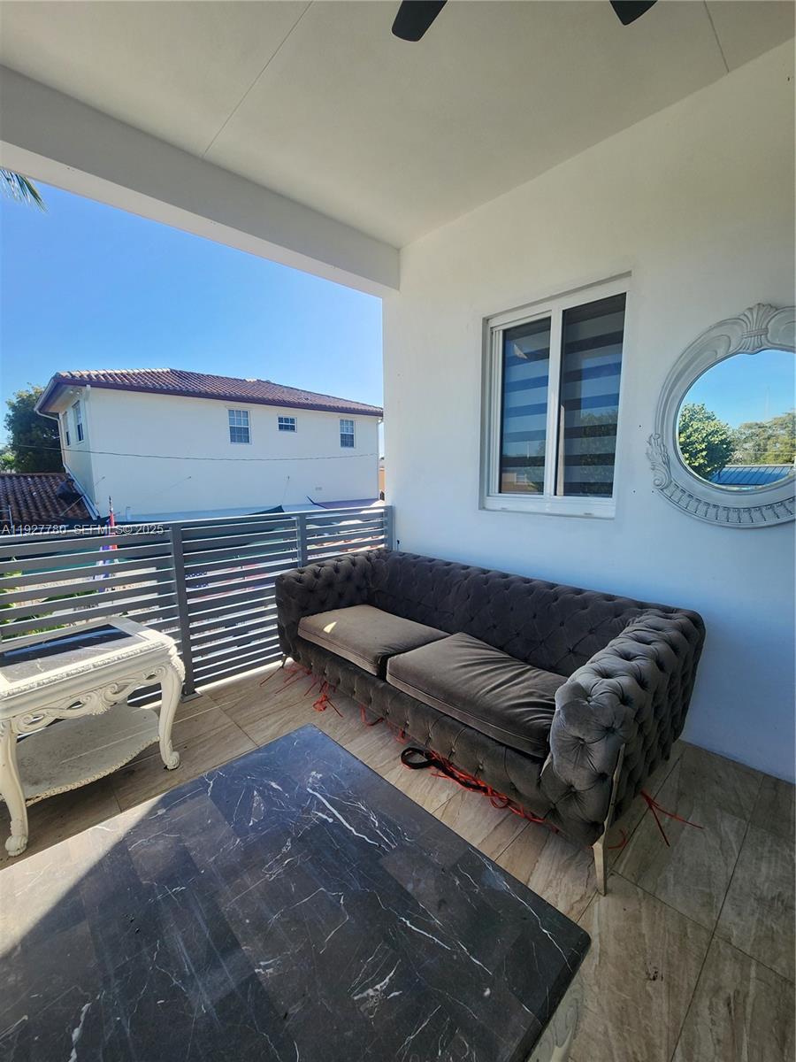 1645 Southwest 83rd Ct. Miami, FL 33155 - Photo 31 of 45 a living room with furniture and a window