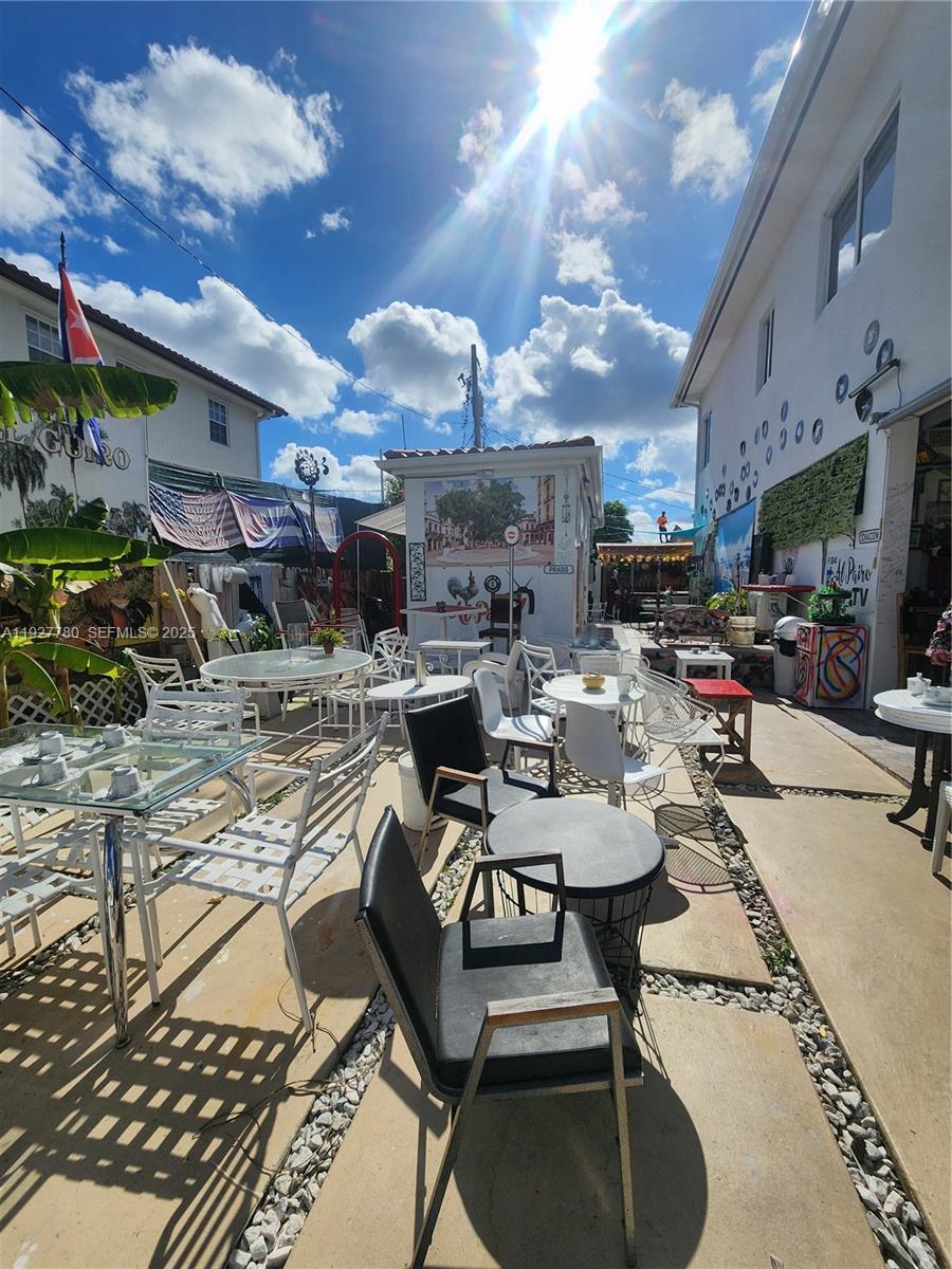 1645 Southwest 83rd Ct. Miami, FL 33155 - Photo 33 of 45 a view of a chairs and table in a patio