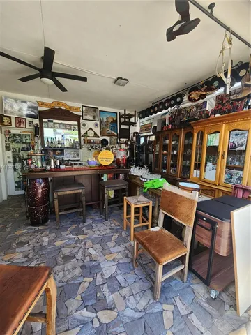 a view of a backyard with plants and a garden